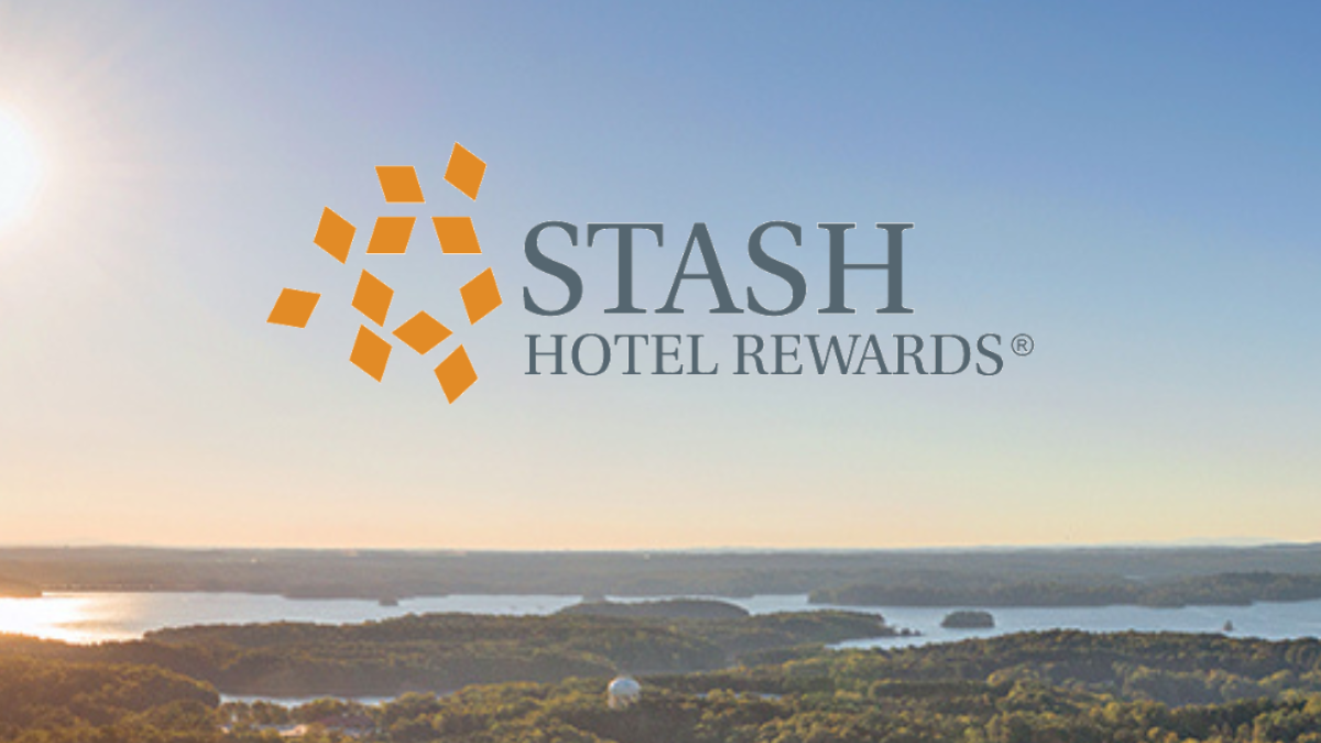 A scenic landscape with a sunrise over lakes and forests, featuring the logo 