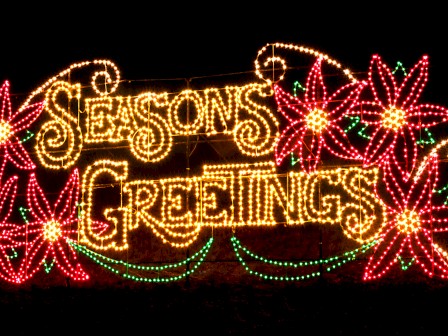 The image shows a festive light display with the words 