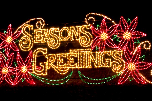 The image shows a festive light display with the words 