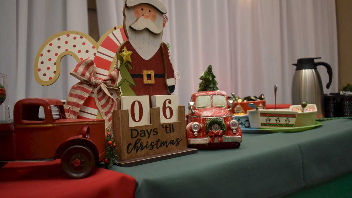 Festive decorations featuring Santa, toy trucks, and a 