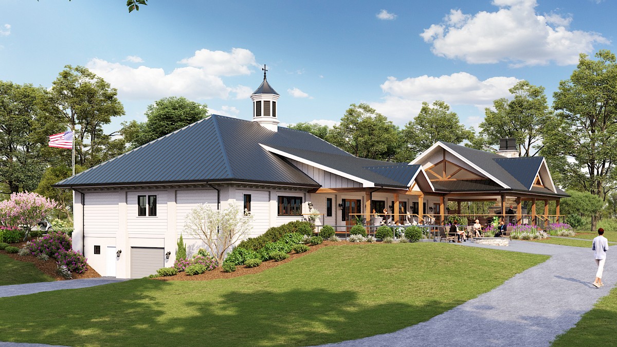 A modern clubhouse with a dark roof, white walls, and a spacious patio, set among trees and a sunny blue sky.