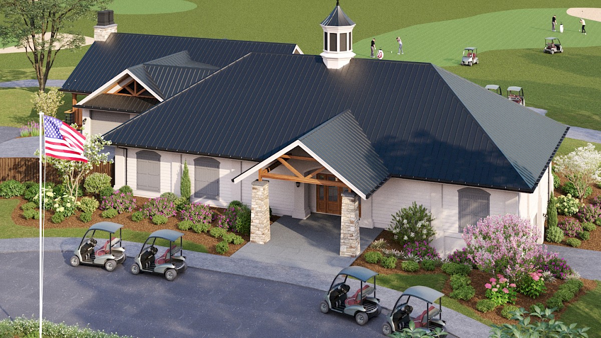 A modern, single-story clubhouse with a dark metal roof, stone accents, a front porch, flag, landscaping, and golf carts parked outside.