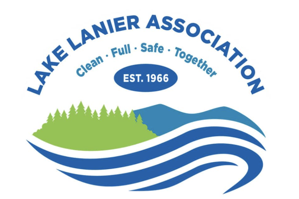 The Lake Lanier Association logo features a mountain, trees, and water with the organization's name, slogan, and establishment date.