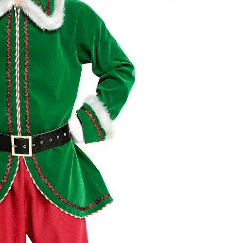 The image shows a person dressed in a green Christmas elf costume with red and white accents, red pants, and a black belt with a gold buckle.